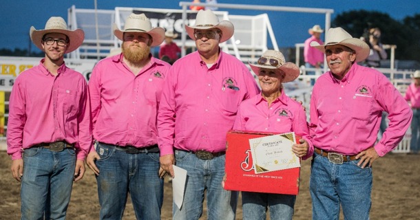 Logan Zeckser (far left) and Cindy Hinrichs, second from right, were awarded the Volunteer of the Year and the Committee Person of the Year, respectively, for their work with the Oregon Trail Rodeo in Hastings, Neb. Presenting the awards is, from left to right, Patrick Niles, Scott Hinrichs, and Dwight Dunsworth. Photo by Anita Burcham.  